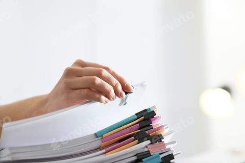 Preview: Employee working with documents in office, closeup. Space for text