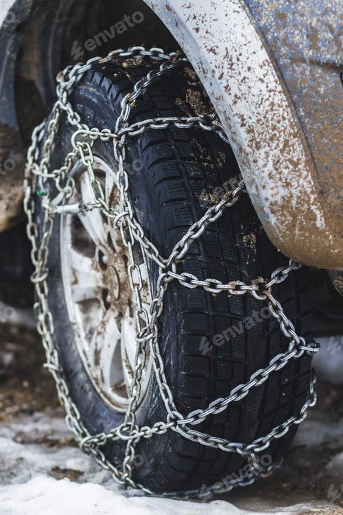 Preview: Сhains on the wheels of the jeep in bad dirty snowy weather