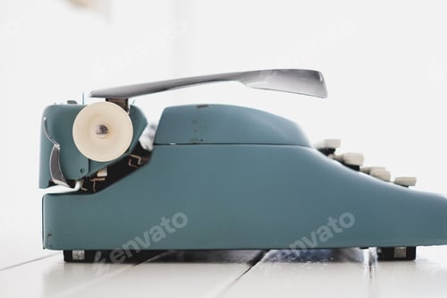 Preview: Sideview of a blue vintage typewriter