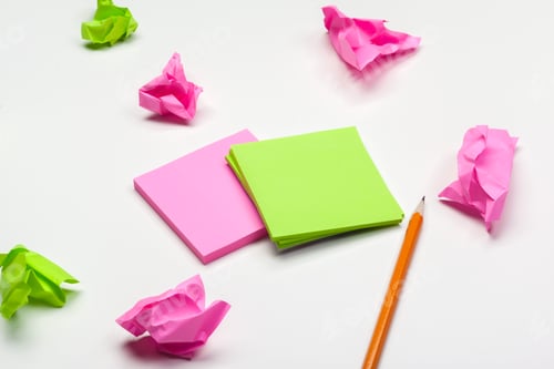 Preview: crumpled paper on white table brainstorming in the office concept