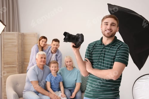 Preview: Professional photographer with camera and family in studio