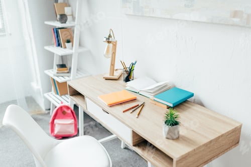 Preview: Minimalistic room interior with writing desk and school supplies placed on it.