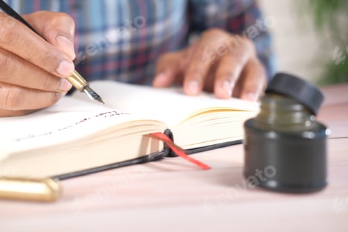 Preview: Close up of man hand writing a letter with fountain pen