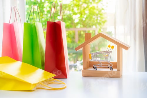 Preview: Colorful paper shopping bags on white table, Online shopping at home concept