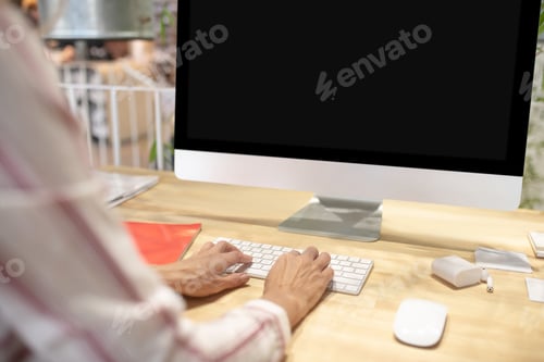 Preview: Female hands typing on keyboard in front of screen