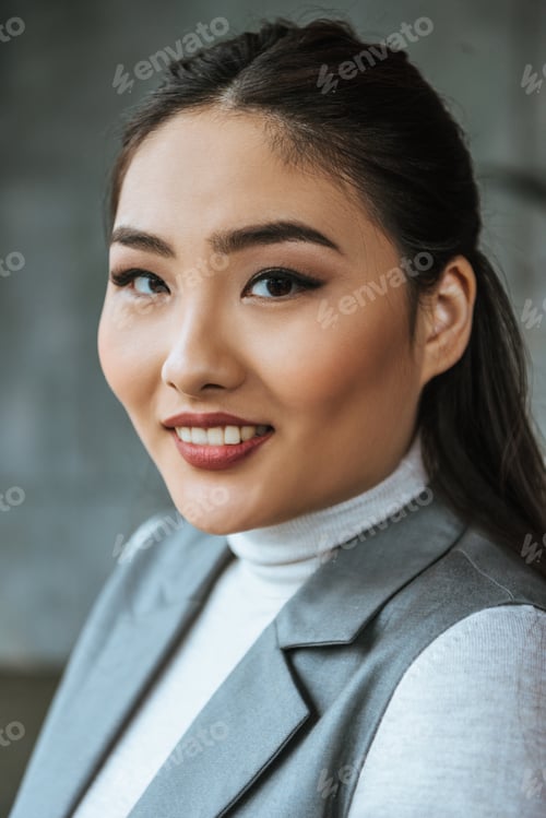 Preview: portrait of beautiful young kazakh woman smiling at camera
