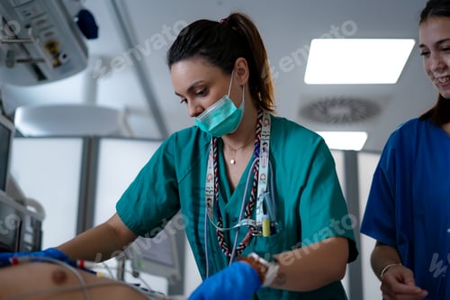 Preview: nurses performing electrocardiogram on a patient in ICU