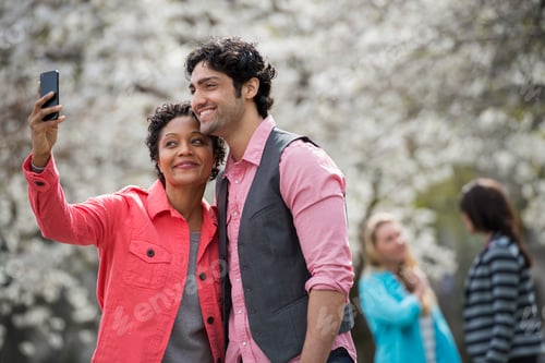 Preview: People outdoors in the city, woman taking selfie