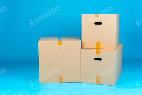 Preview: Stack of cardboard boxes on blue background