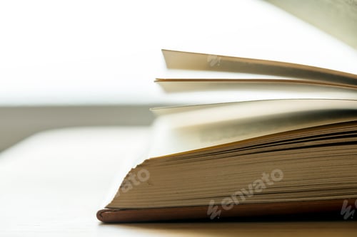 Preview: Closeup of an open book educational, academic and literary concept