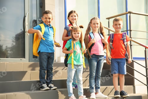 Preview: Cute little children with backpacks outdoors. Elementary school