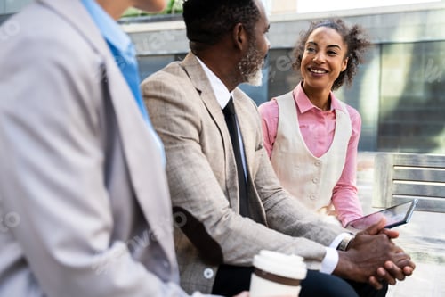 Preview: Group of multiethnic business people meeting outdoors