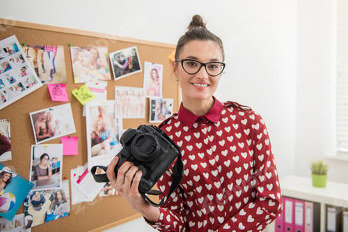 Preview: Professional photographer posing with her camera