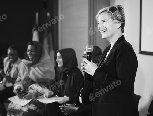 Preview: A Western Business Woman Speaking into a Microphone