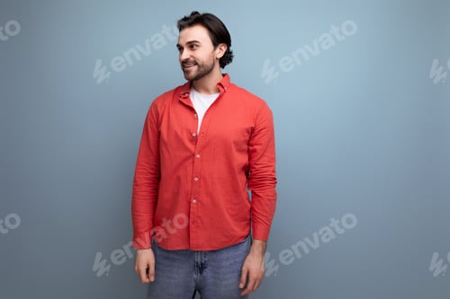 Preview: Smiling Man in Red Shirt and Jeans Posing