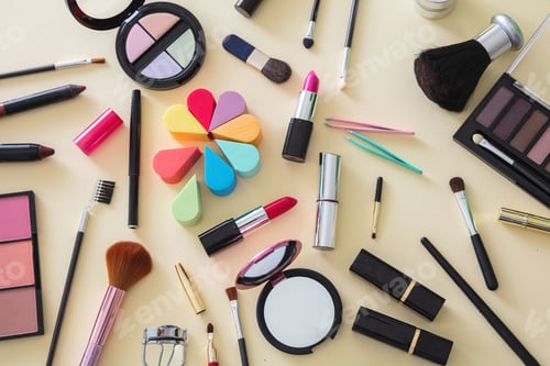 Preview: Make up cosmetics products against yellow color background