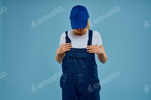 Preview: Woman in work uniform blue cap carriage delivery service courier blue background