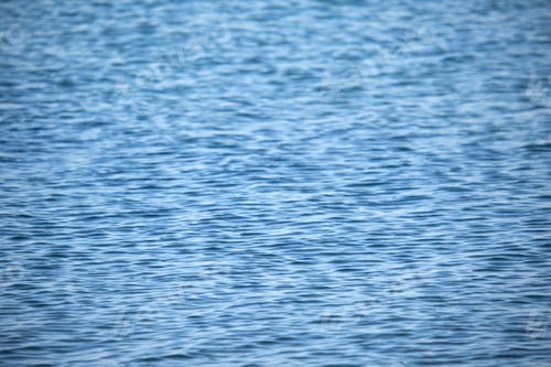 Preview: Closeup seascape surface of blue sea water with small ripple waves.