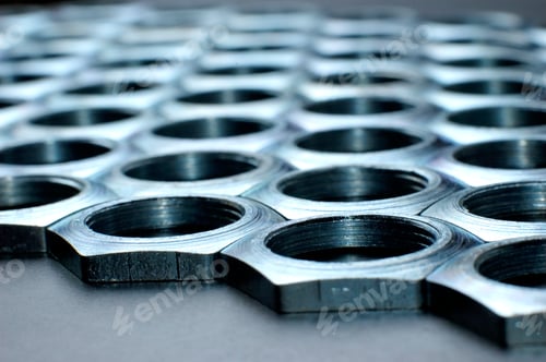 Preview: Side view close-up chrome metal nuts