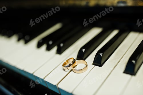 Preview: Wedding rings at the piano keys