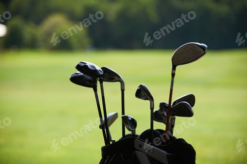 Preview: golf clubs on the background of a green lawn