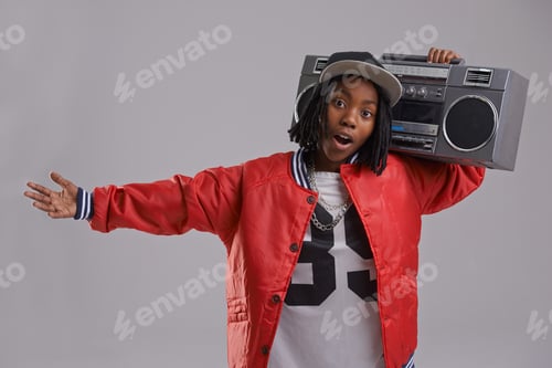 Preview: Turn down for what. Studio shot of a young boy dressed in hip hop attire.