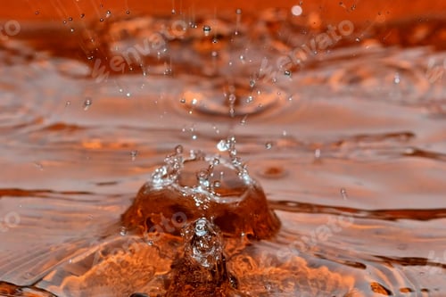 Preview: Raindrop Splashes - Close Up Photograph Of Raindrop Splashes In A Clay Bird Bath. Filter Added For