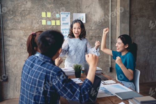 Preview: Group of creative young Asian business people happy, successful work, accomplished goals.
