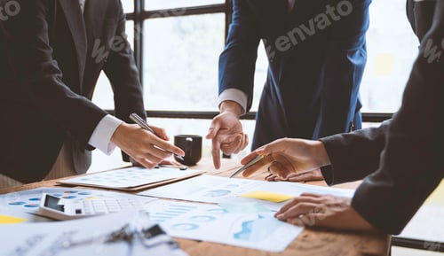 Preview: Business people using pen,tablet,notebook are planning a marketing plan to improve the quality of th