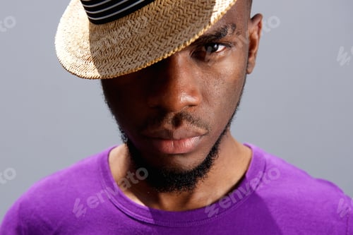 Preview: Young african man wearing a hat