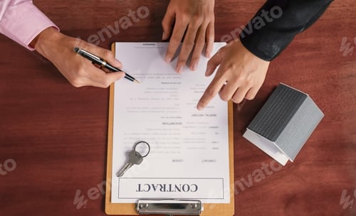 Preview: Hand signing on contract after the real estate agent explains the business contract