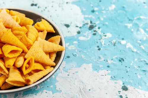 Preview: front view little spicy chips inside plate on light blue background chips snack color crisp calorie