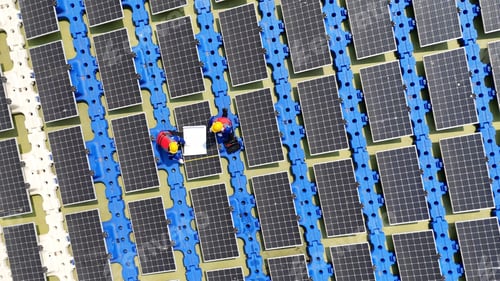 Preview: Floating solar panels providing renewable energy. Aerial view floating on solar cells