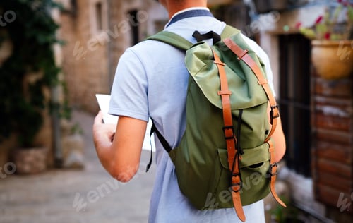 Preview: Happy young tourist man having fun and travelling on summer vacation
