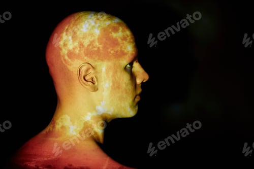Preview: Flames from Atomic Explosion Projected on Profile of Bald Man Standing against Black