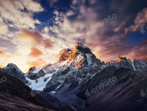 Preview: Autumn landscape and snow mountains in beautiful cumulus clouds.