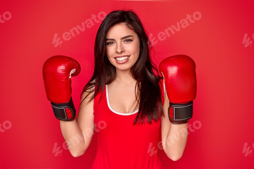Preview: Smiling female in boxing gloves