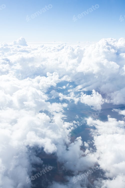 Preview: Clouds fill the sky above a serene ocean, creating a breathtaking viewpoint in the midst of a sunny