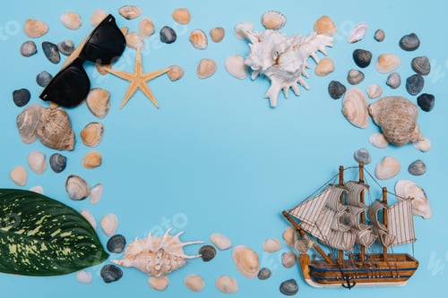 Preview: Flat lay. Top view. Frame of shells of various kinds on a blue background.