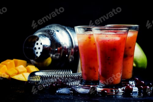 Preview: Alcoholic cocktail mango and cranberry liqueur with syrup, juice and ice