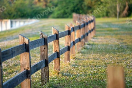Preview: Wooden fence barrier at farm grounds for cattle and territory protection