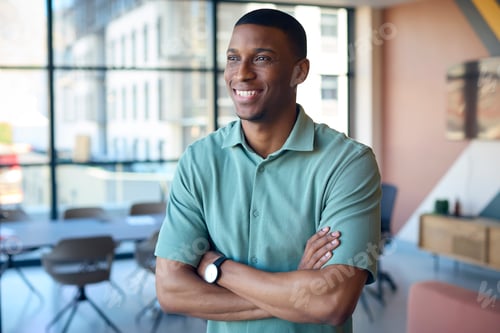 Preview: Portrait Of Smiling Businessman Standing In Empty Office