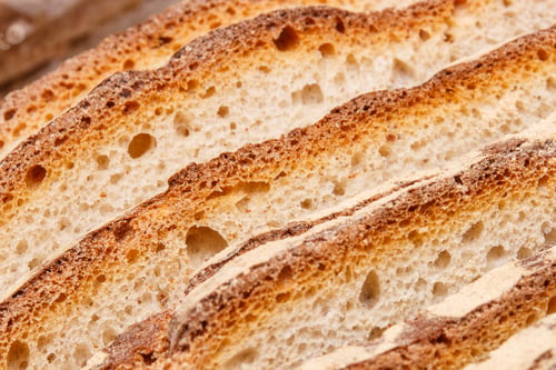 Preview: Slices of fresh baked traditional loaf of rye bread