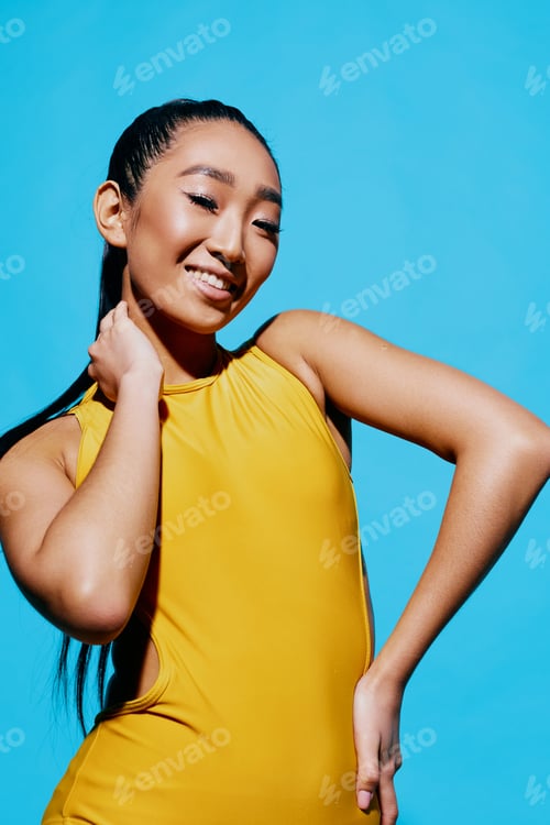Preview: Lifestyle woman blue fashion black smile yellow expression surprised trendy portrait beauty