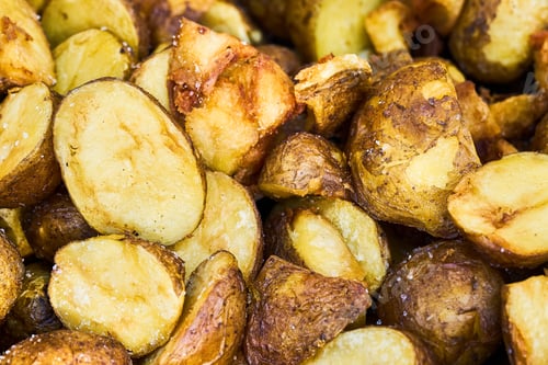 Preview: Fried baby potatoes in a frying pan. Top view