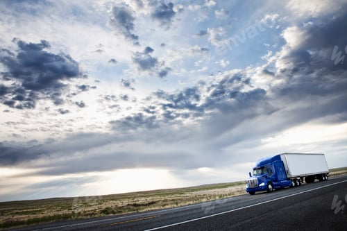 Preview: commercial truck driving through the high desert country of eastern Washington, USA
