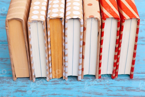 Preview: books on blue wooden background