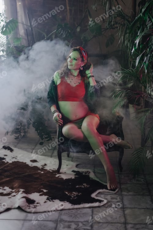Preview: Pregnant woman with a big belly feeling happy.Woman pregnancy concept