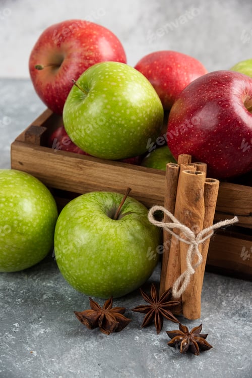 Preview: Whole delicious green and red apples in wooden box