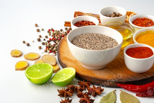 Preview: Bowls with spices on wooden board on white background